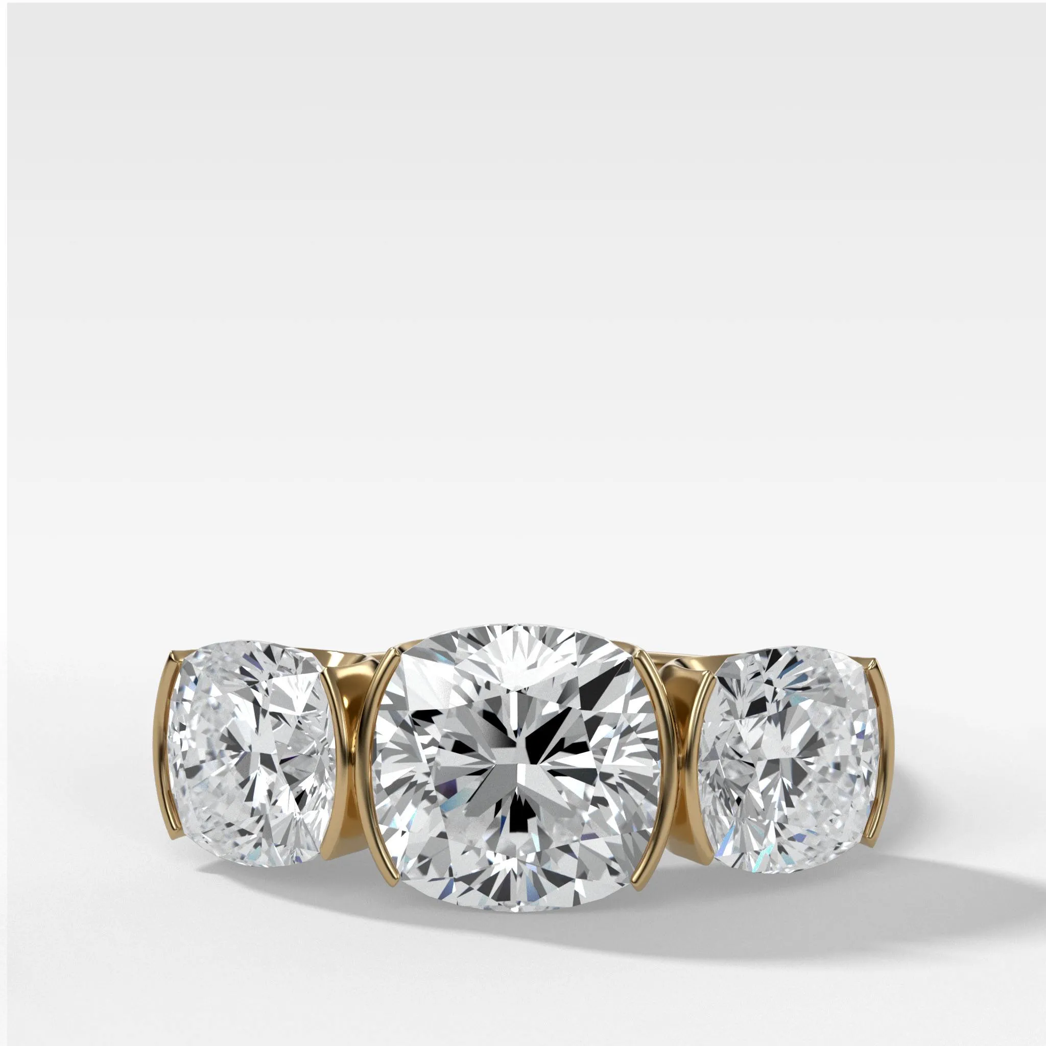 Half Bezel Triad Engagement Ring With Cushion Cut Diamonds