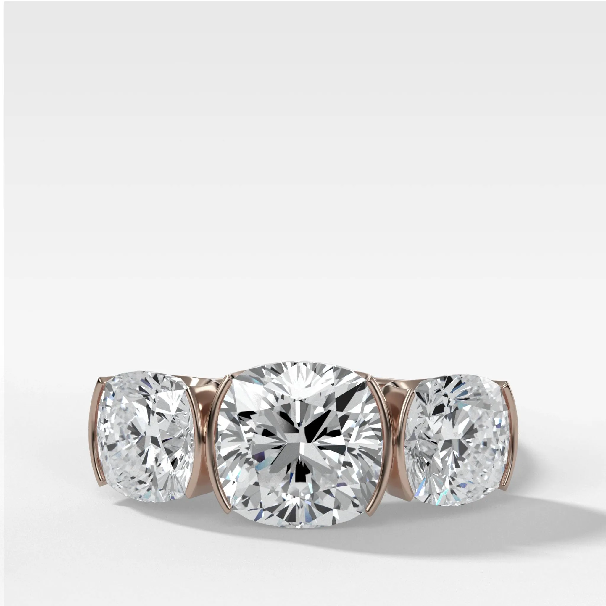 Half Bezel Triad Engagement Ring With Cushion Cut Diamonds