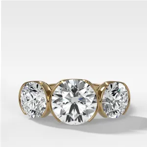 Half Bezel Triad Engagement Ring With Round Cut Diamonds