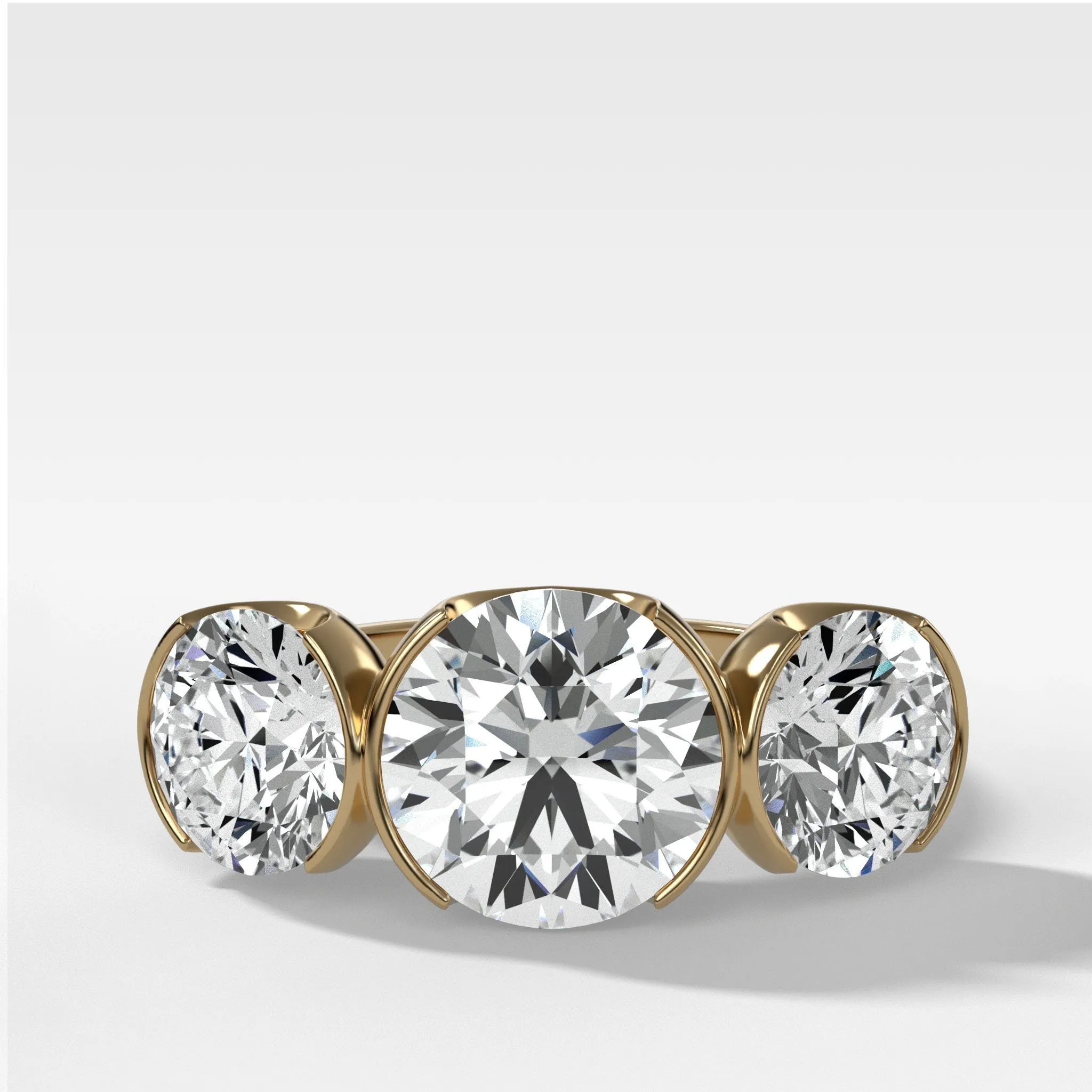 Half Bezel Triad Engagement Ring With Round Cut Diamonds