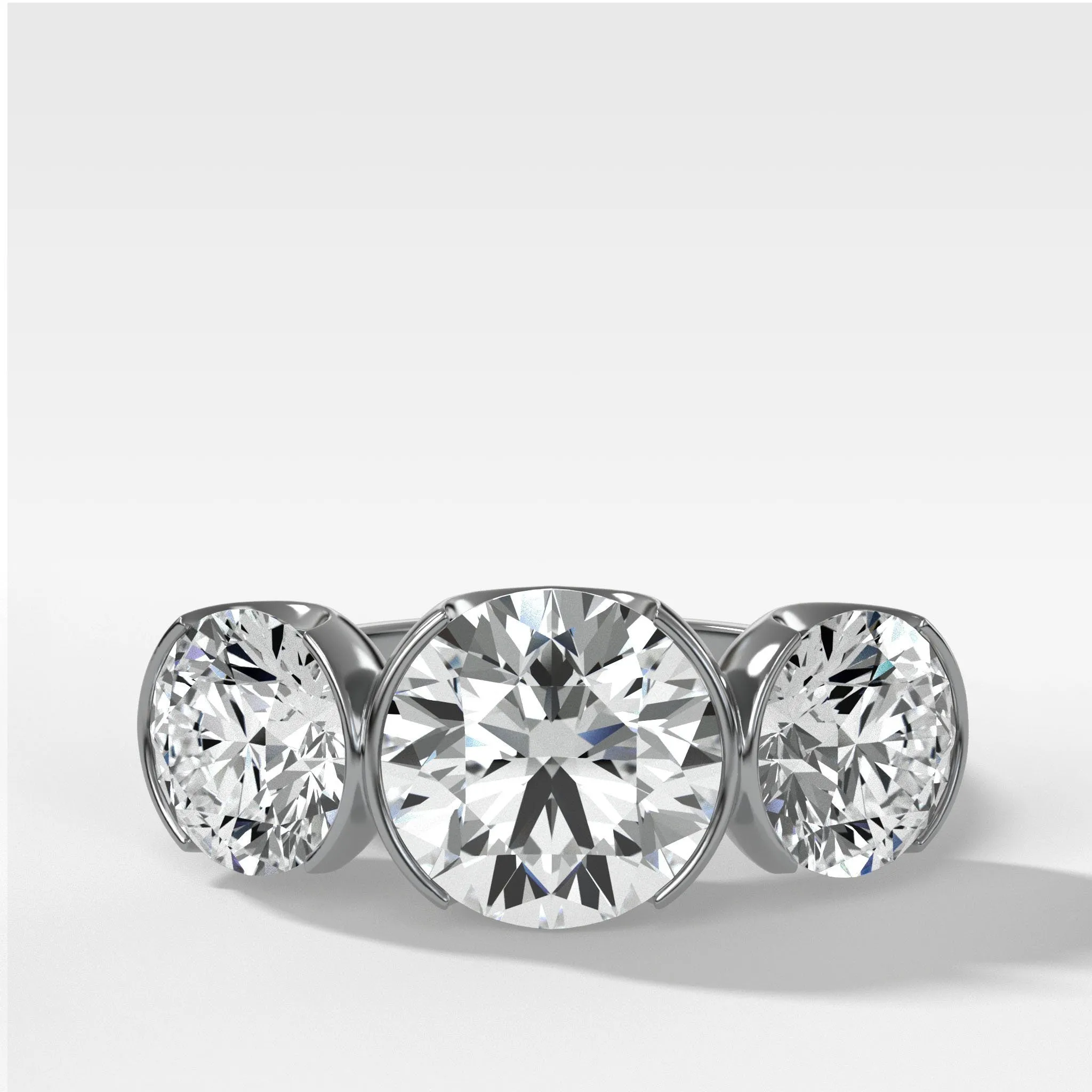 Half Bezel Triad Engagement Ring With Round Cut Diamonds