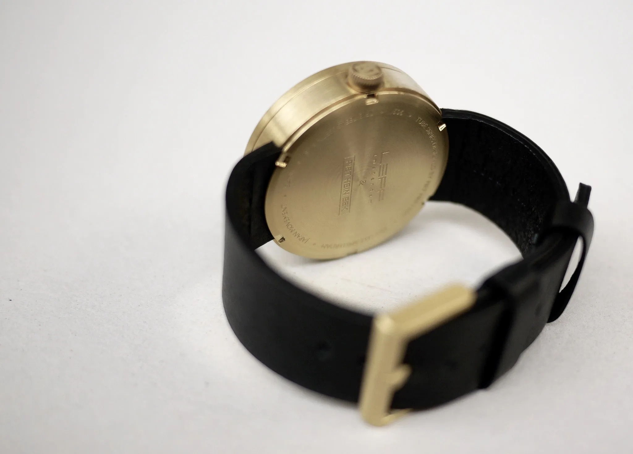 Tube watch D42 brass with black leather strap