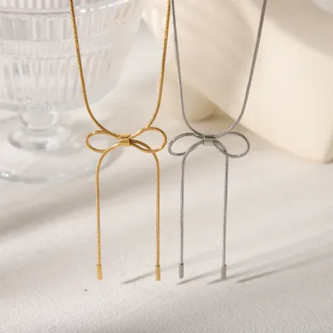 White Gold Plated Necklace With Long Bow Knot Detail